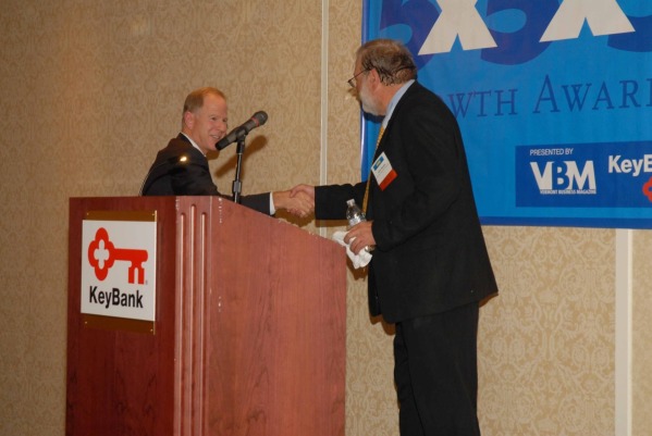 5x5x5 awards john boutin welcomes scott carpenter president keybank vt to the dias for his opening remarks.jpg